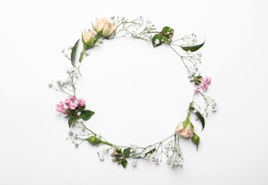 Photo of Frame made of beautiful gypsophila and other flowers on white background, top view. Space for text