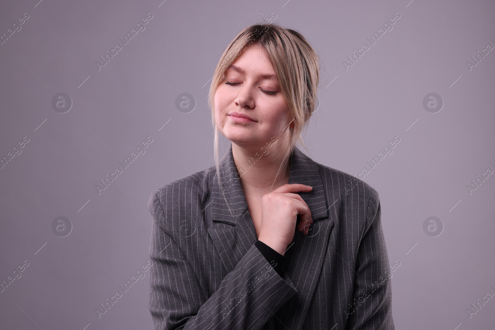 Photo of Portrait of beautiful young woman on grey background