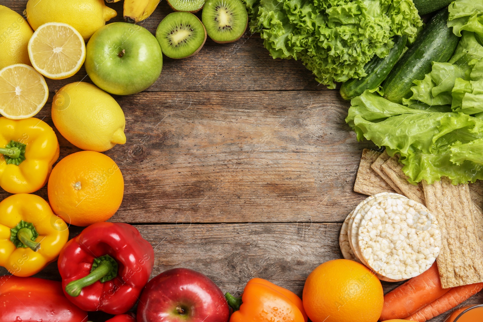 Photo of Flat lay composition with healthy food and space for text on wooden background. Concept of weight loss