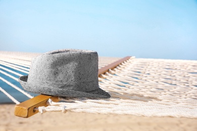 Photo of Hammock and hat at seaside. Time to relax