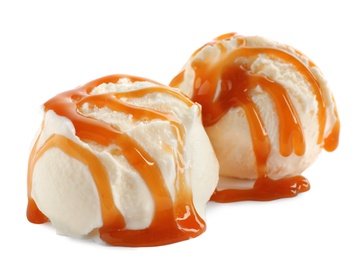 Photo of Scoops of delicious ice cream with caramel sauce on white background