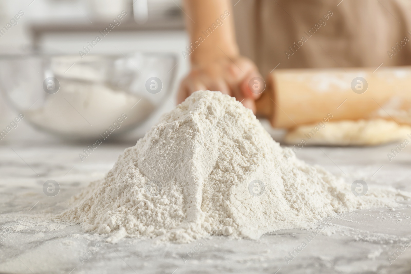 Photo of Pile of flour and woman on background