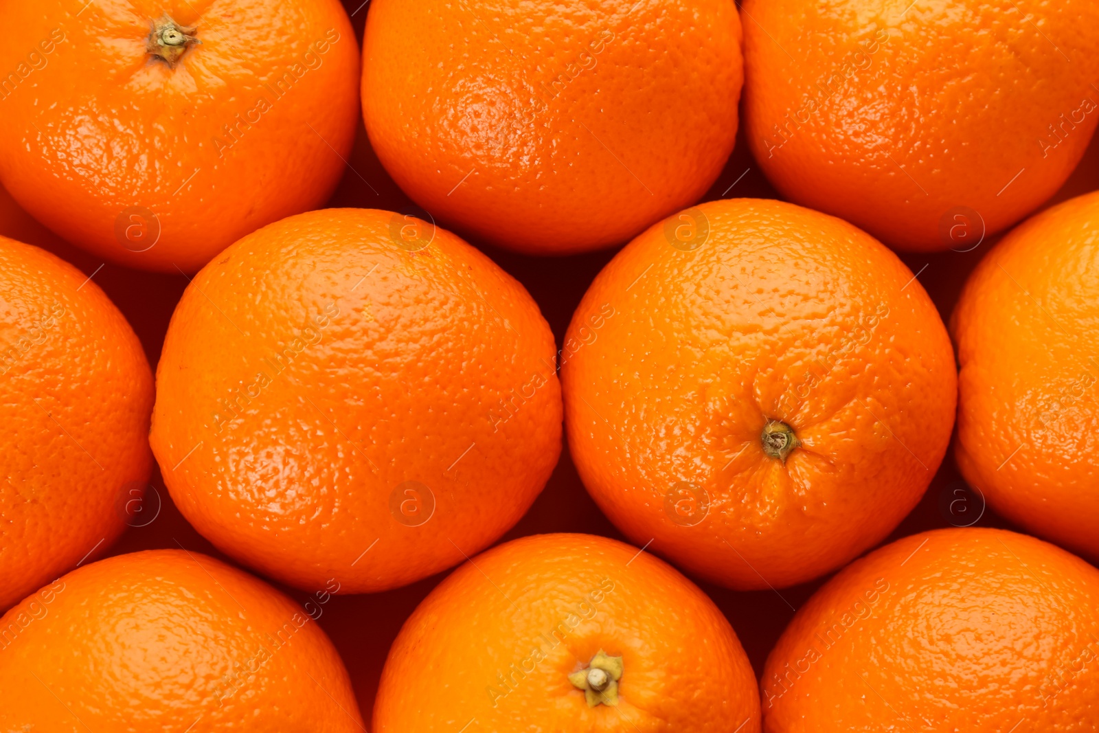 Photo of Fresh ripe oranges as background, top view