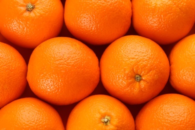 Fresh ripe oranges as background, top view