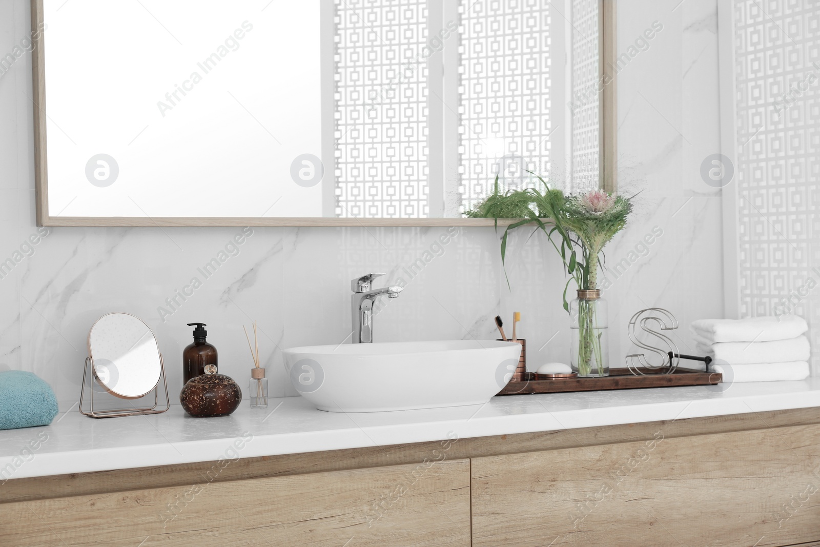 Photo of Modern bathroom interior with stylish mirror and vessel sink