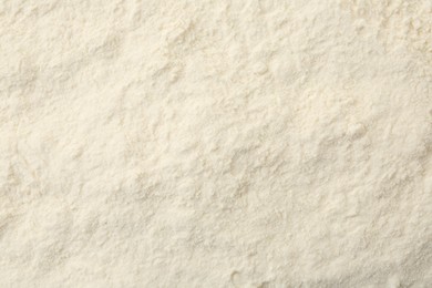 Photo of Texture of baking powder as background, top view