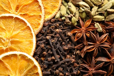 Photo of Different mulled wine ingredients as background, closeup