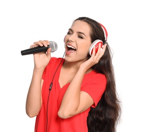 Photo of Young woman singing into microphone on white background. Christmas music
