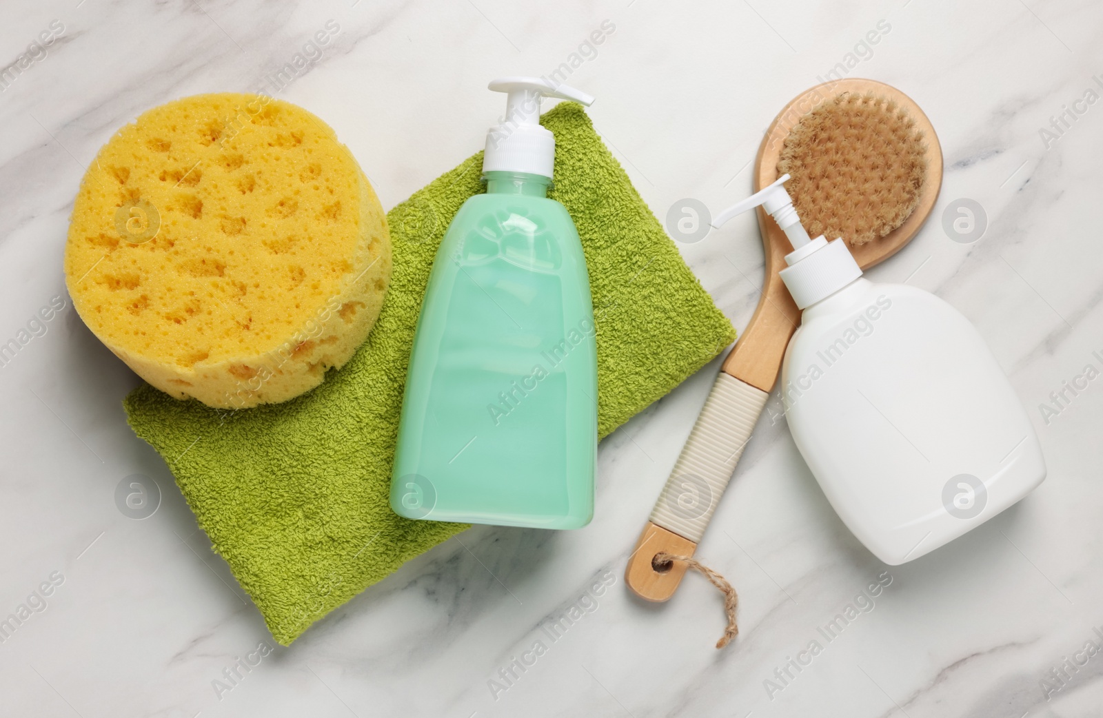 Photo of Flat lay composition with dispensers of liquid soap on white marble table