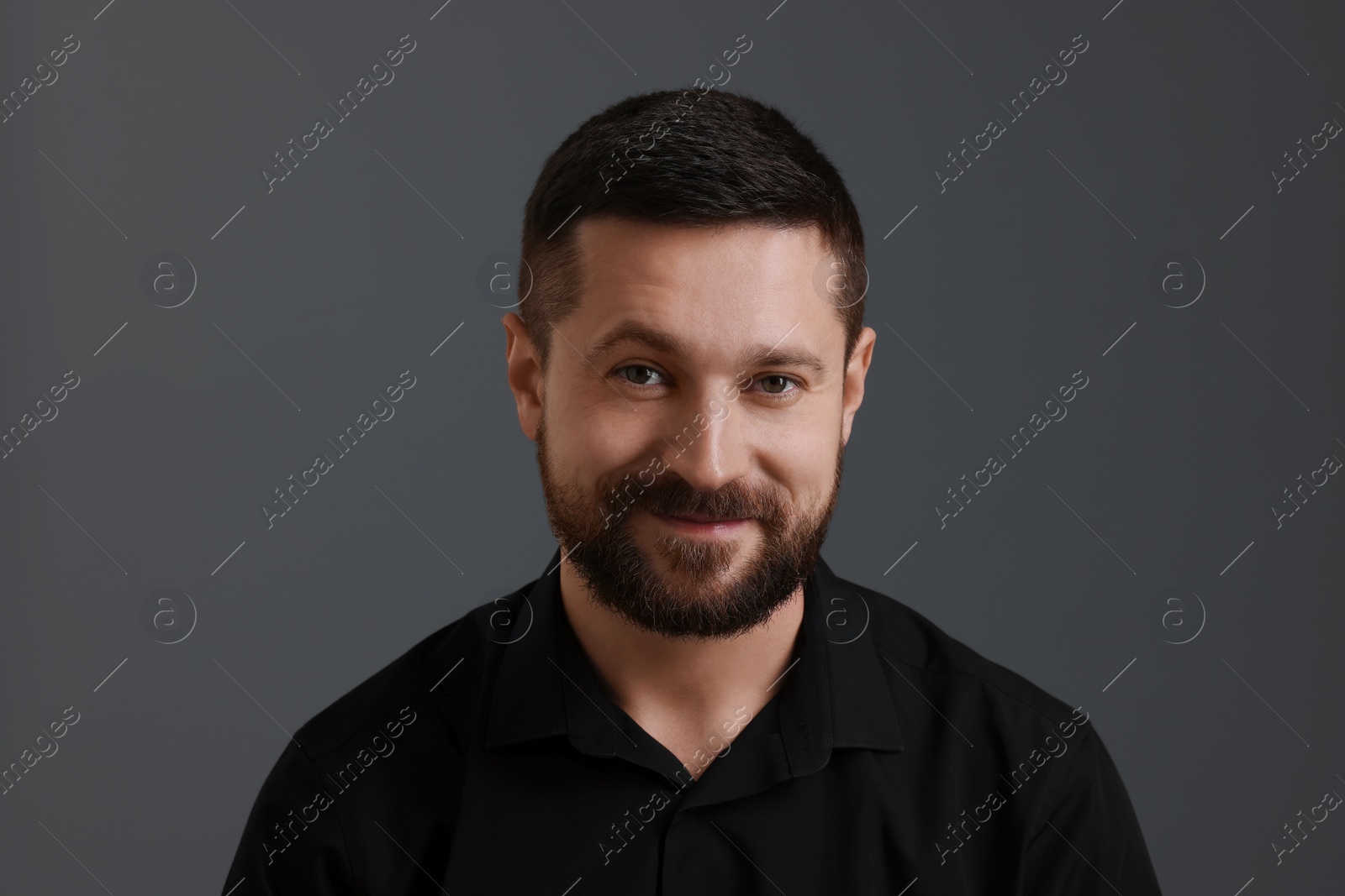 Photo of Personality concept. Handsome man on grey background