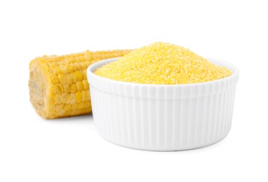 Raw cornmeal in bowl and corn cob isolated on white