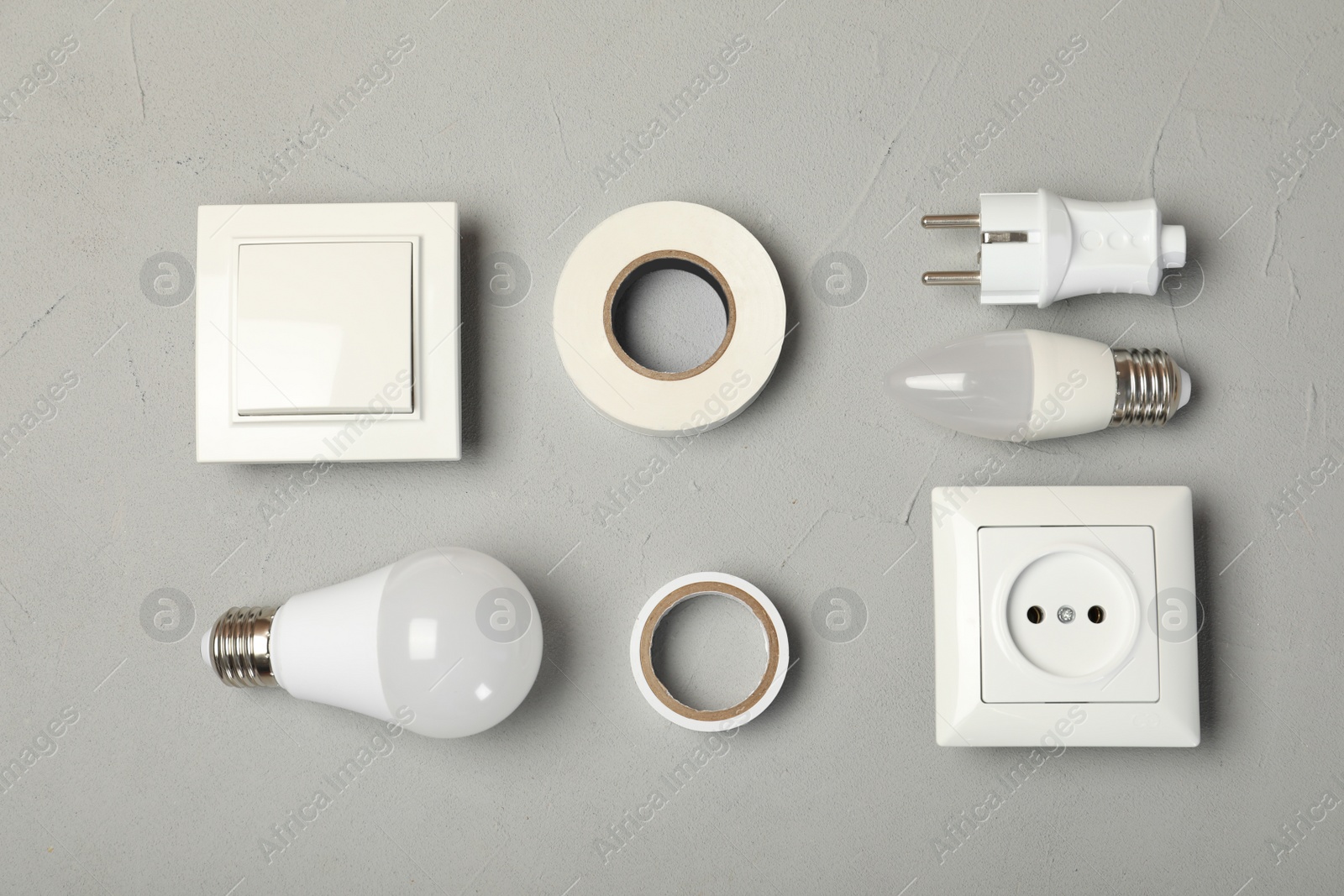 Photo of Flat lay composition with electrician's tools on gray background