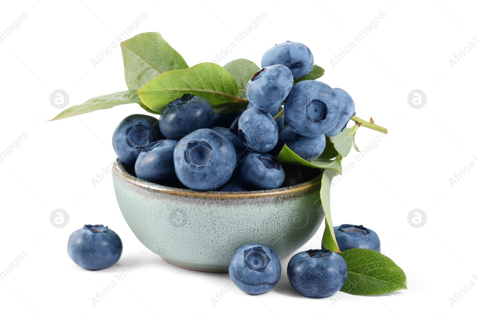 Photo of Fresh ripe blueberries and leaves isolated on white