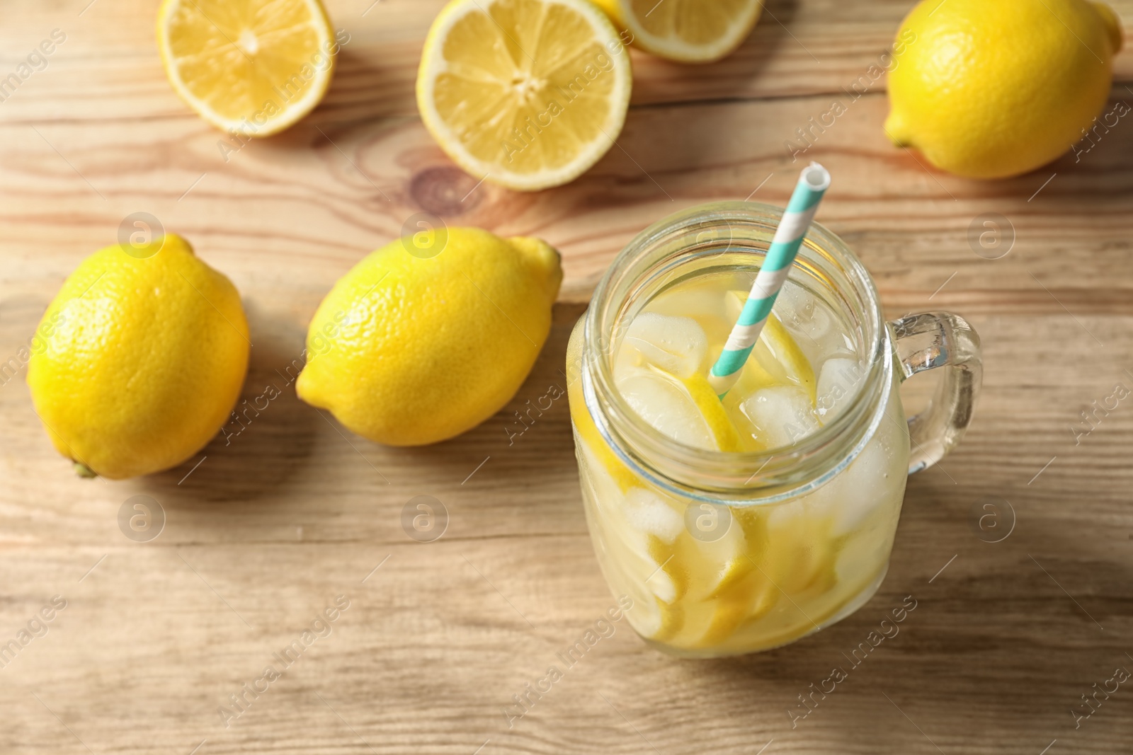 Photo of Natural lemonade in mason jar on wooden table