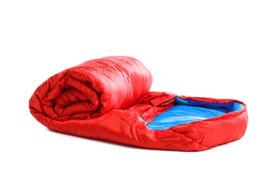 Photo of Rolled sleeping bag on white background. Camping equipment