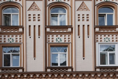 Photo of Wall of vintage building with beautiful windows