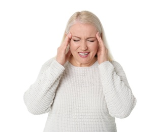 Mature woman suffering from headache on white background