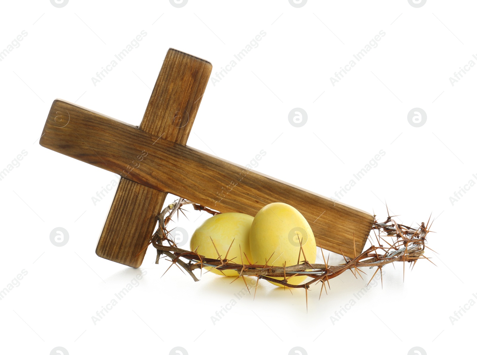 Photo of Wooden cross, crown of thorns and Easter eggs on white background