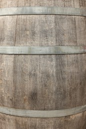 Photo of Traditional wooden barrel as background, closeup. Wine making