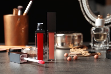 Beautiful composition with lipsticks on table. Space for text