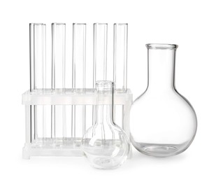 Photo of Empty laboratory flask and test tubes isolated on white