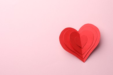 Paper hearts on pink background, top view. Space for text