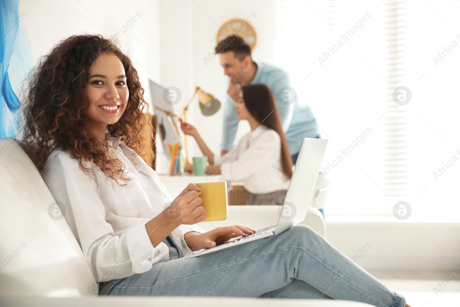 Photo of Professional designer working with laptop in modern office