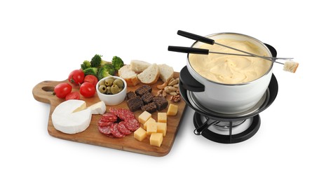 Photo of Fondue with tasty melted cheese, forks and different snacks isolated on white