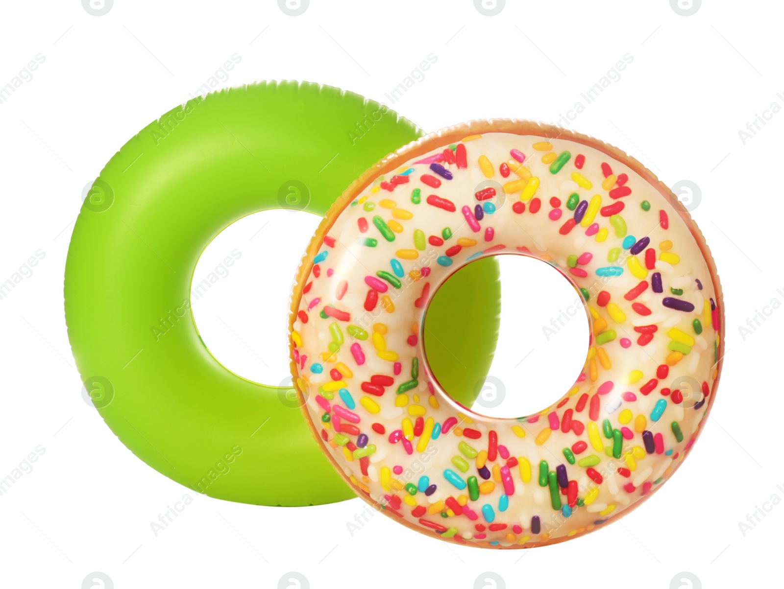 Photo of Different bright inflatable rings on white background. Summer holidays