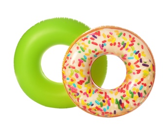 Different bright inflatable rings on white background. Summer holidays