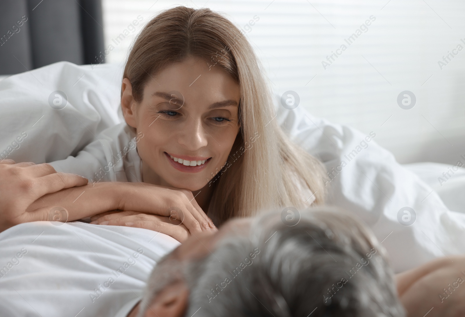 Photo of Lovely mature couple in bed at home