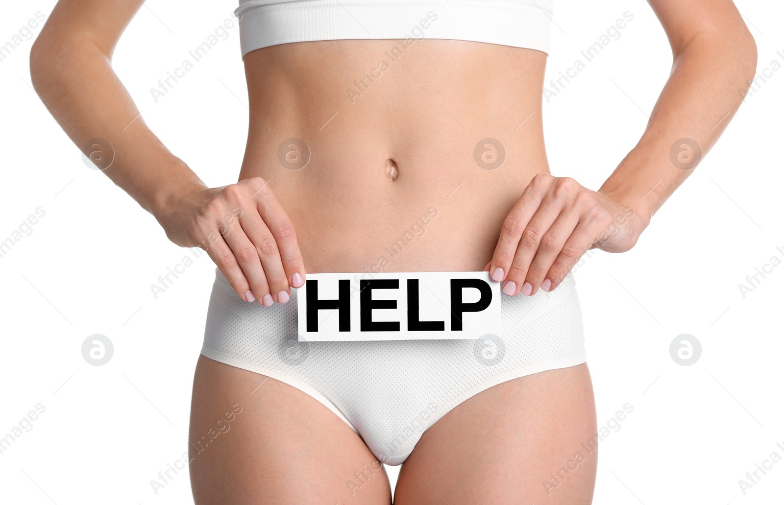 Photo of Young woman holding card with word HELP on white background. Gynecology concept