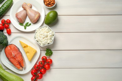 Photo of Flat lay composition with different fresh products on white wooden table, space for text. Keto diet