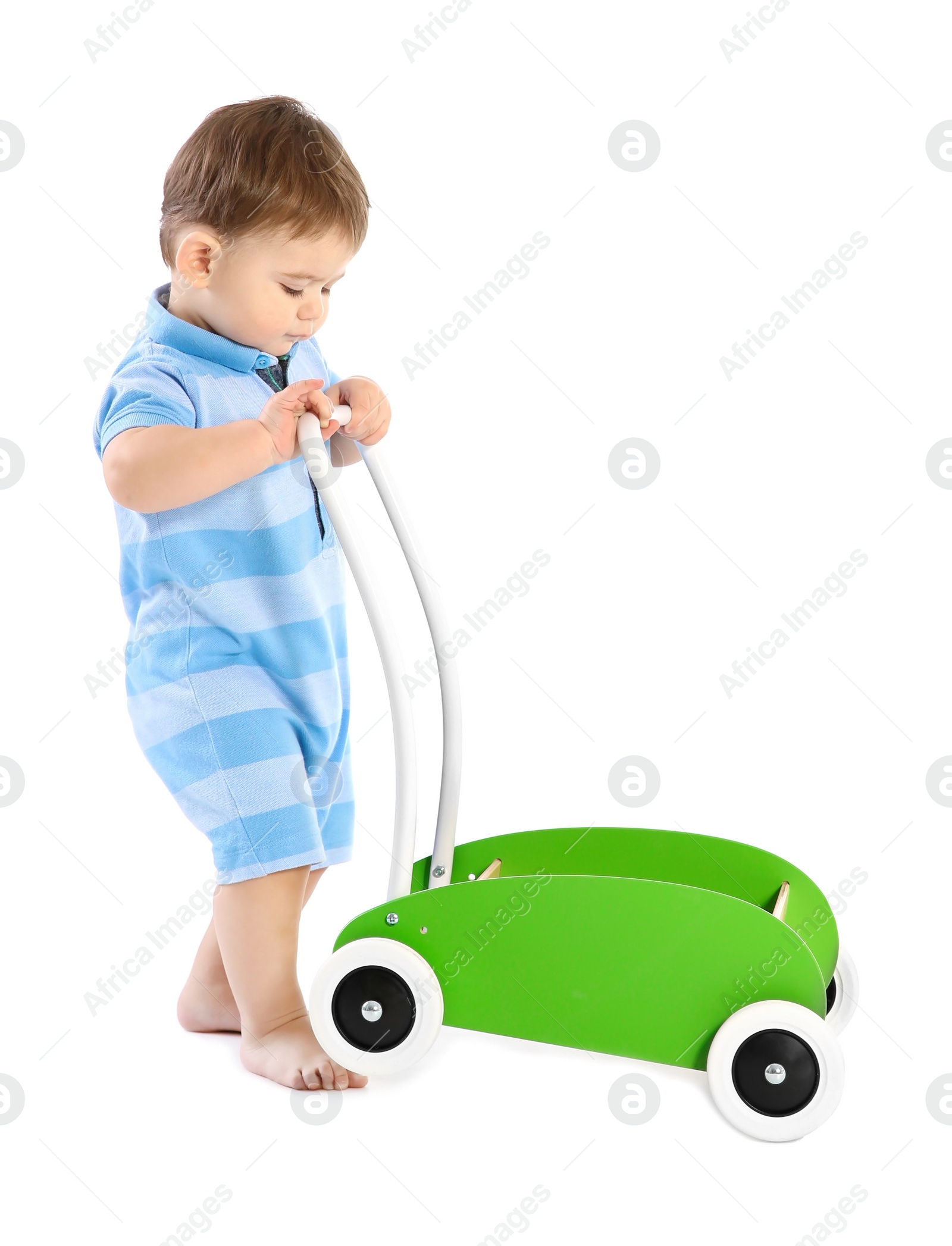 Photo of Cute baby playing with toy walker on white background