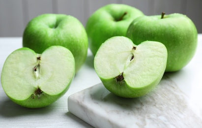 Photo of Fresh green apples on light table