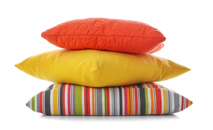 Photo of Stack of different colorful pillows on white background