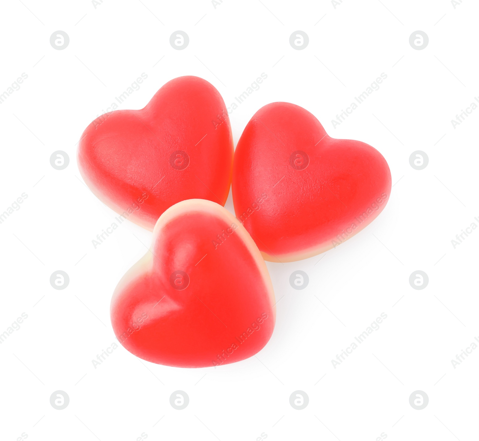Photo of Sweet heart shaped jelly candies on white background, top view