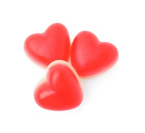 Photo of Sweet heart shaped jelly candies on white background, top view