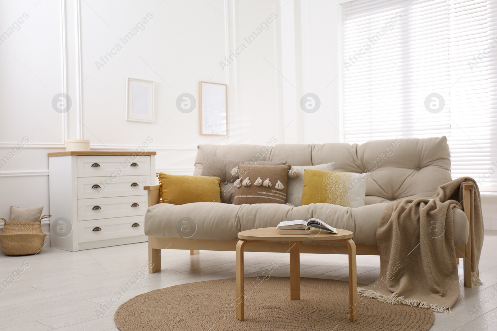 Photo of Stylish living room interior with comfortable sofa and small table