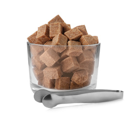 Photo of Glass bowl with brown sugar cubes and tongs isolated on white