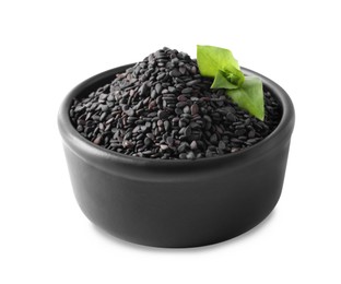 Black sesame seeds with green leaf in bowl on white background