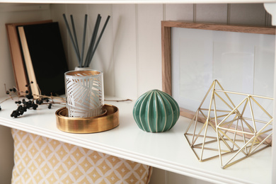 White shelving unit with books and different decorative stuff