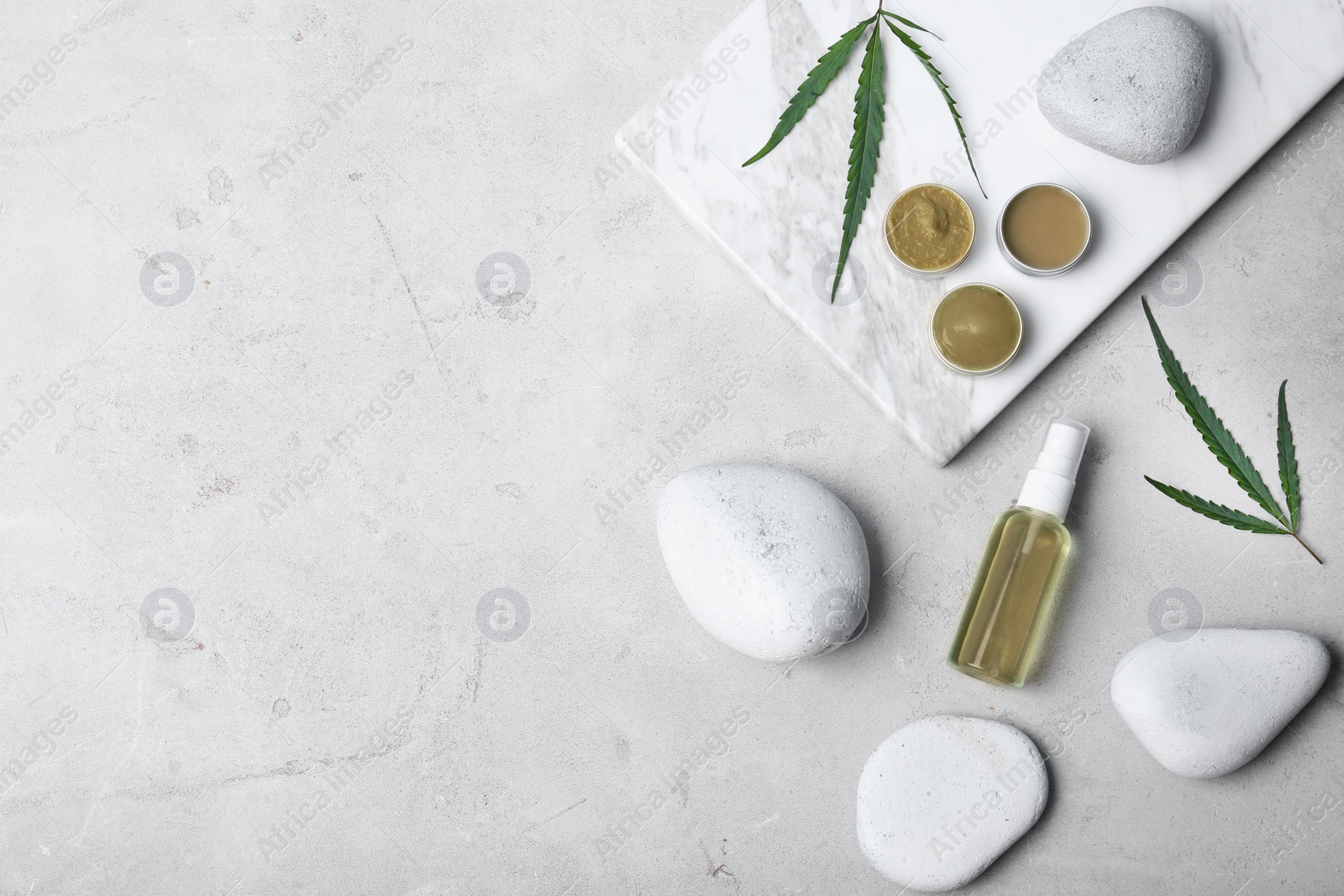 Photo of Flat lay composition with hemp lotion and space for text on light background