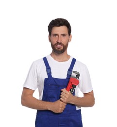 Professional plumber with pipe wrench on white background