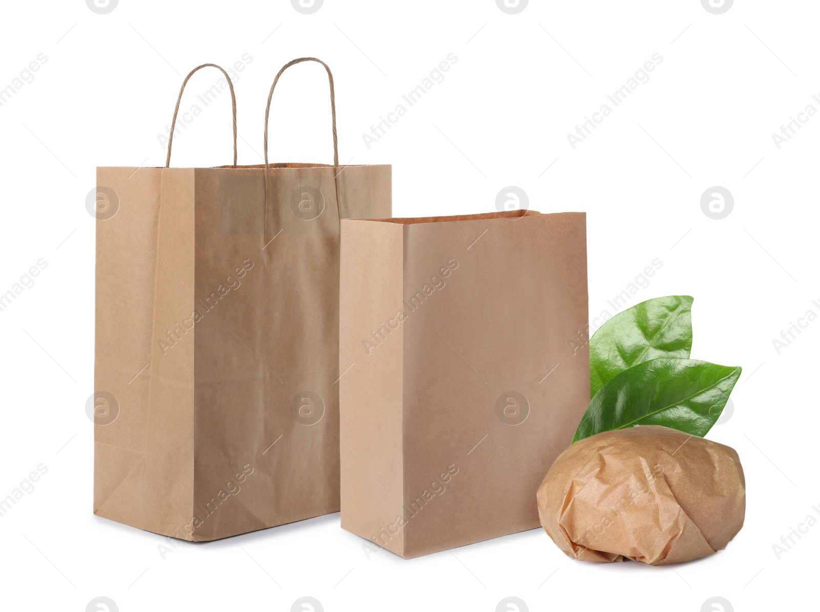 Image of Different containers and green fresh leaves on white background