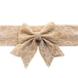 Photo of Lacy burlap ribbon with pretty bow on white background, top view