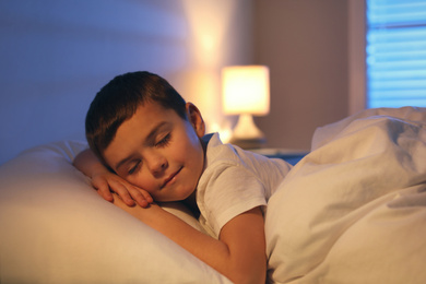 Photo of Cute little boy sleeping at home. Bedtime