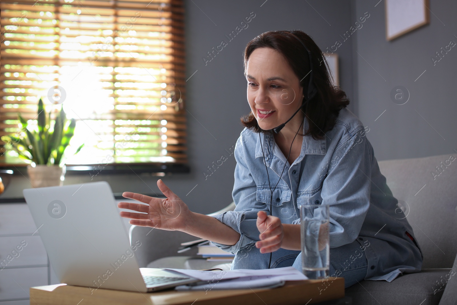 Photo of Teacher conducting online lesson at home during COVID-19 quarantine