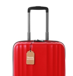 Photo of Red suitcase with TRAVEL INSURANCE label on white background