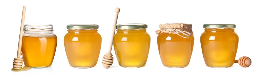 Image of Natural honey in glass jars and dippers isolated on white, set